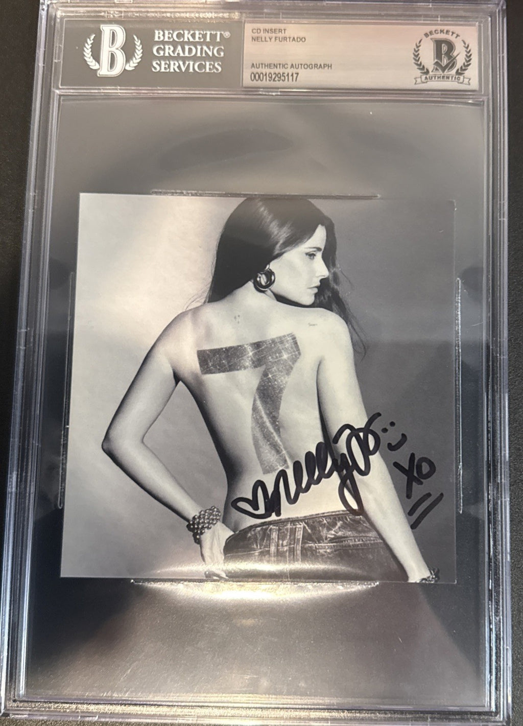 Nelly Furtado SIGNED CD Insert “7” - Beckett BAS Encased Slab
