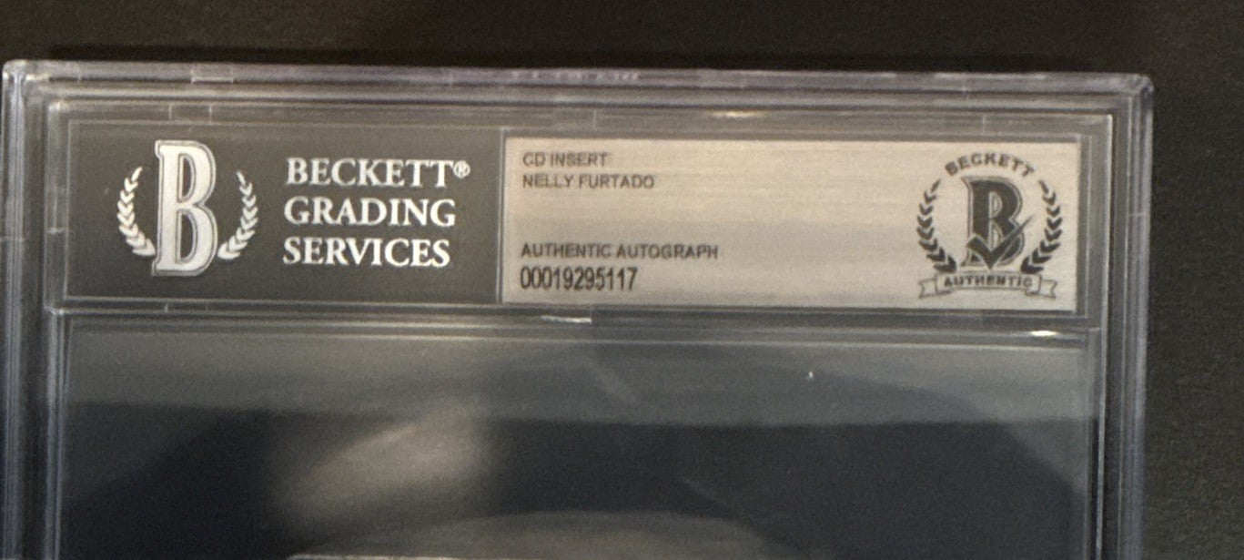 Nelly Furtado SIGNED CD Insert “7” - Beckett BAS Encased Slab