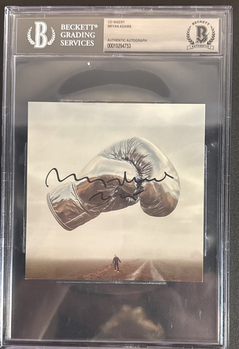 Bryan Adams SIGNED CD Insert “Roll With The Punches” - Beckett BAS Encased Slab