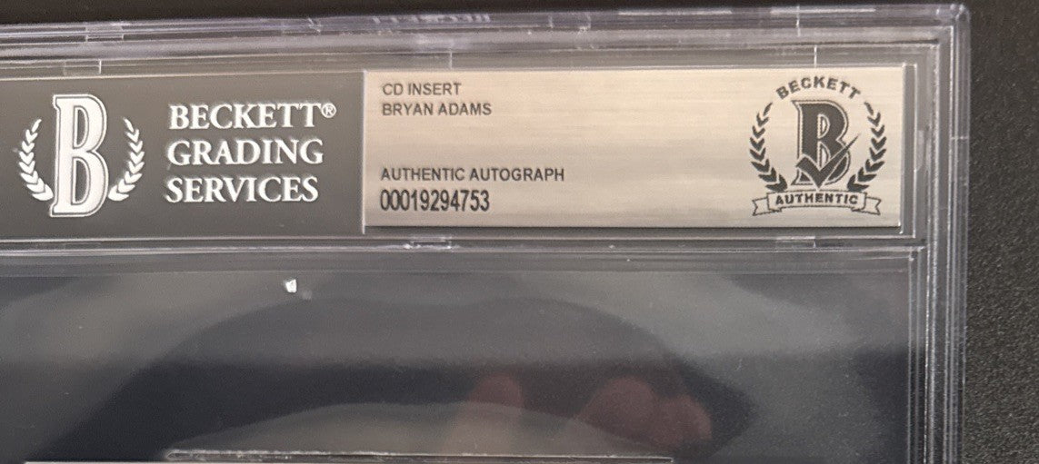 Bryan Adams SIGNED CD Insert “Roll With The Punches” - Beckett BAS Encased Slab