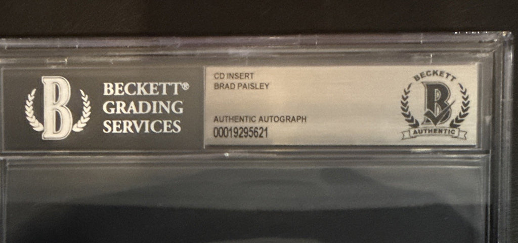 Brad Paisley SIGNED CD Insert “Snow Globe Town” - Beckett BAS Encased Slab