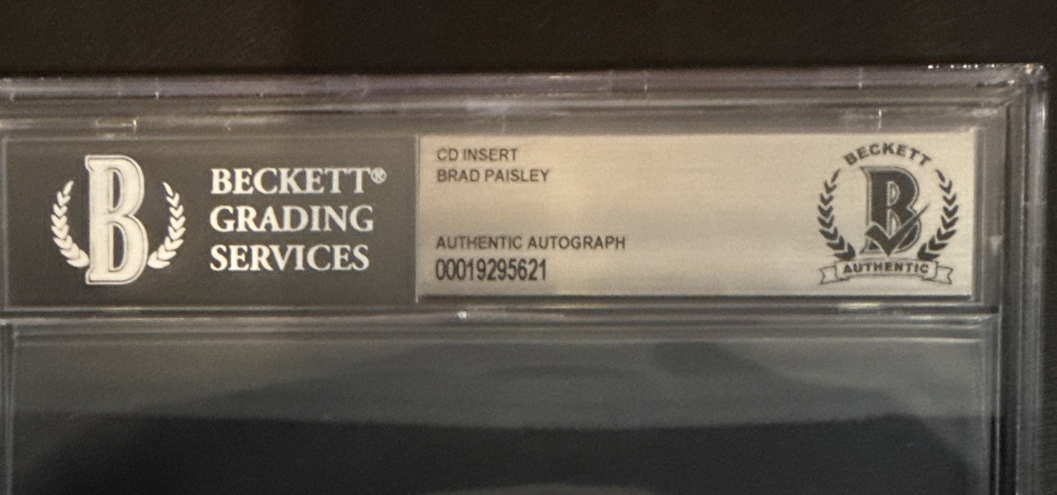 Brad Paisley SIGNED CD Insert “Snow Globe Town” - Beckett BAS Encased Slab