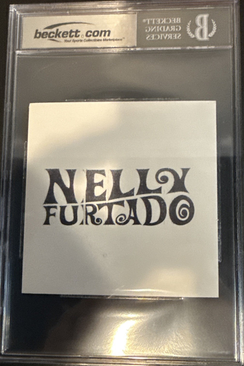 Nelly Furtado SIGNED CD Insert “7” - Beckett BAS Encased Slab